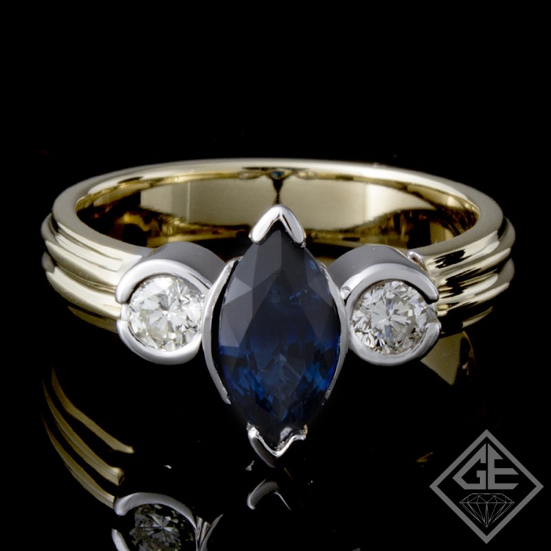 Ladies Beautiful 3-Stone Fashion Ring with 1.20 ct Blue Sapphire and 0.32 ct Round Brilliant Cut Diamonds in 14k 2-tone Gold