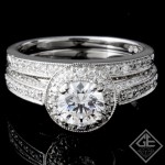 Ladies Halo Diamond Bridal set Ring with 0.98 carat Round brilliant cut side diamonds.